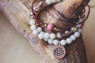 Three natural mineral stone beads bracelet on wooden background