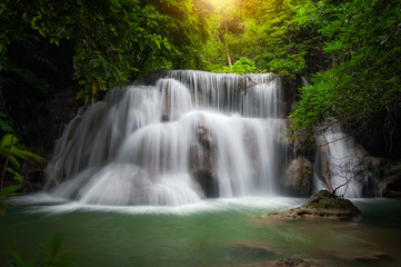 Fototapeta na wymiar Huay mae khamin waterfall, this cascade is emerald green and popular in Kanchanaburi province, Thailand.