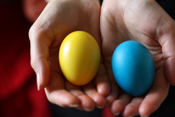 easter eggs in hands
