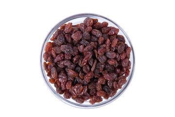 Black raisins in a bowl isolated on white. Fruit background. Top view