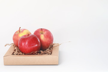 Fresh juicy apples on a white table