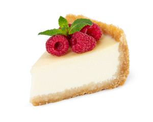 Piece of cheesecake with raspberries and mint isolated on white