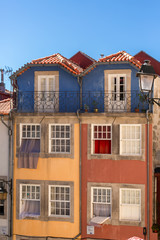 Fototapeta na wymiar View at a traditional and colored urban buildings on Porto downtown