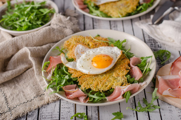 Potato pancakes with eggs and ham