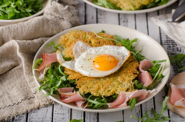 Potato pancakes with eggs and ham