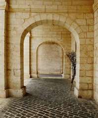 Stone arches covering the walkway