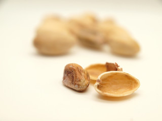 Pistachios fruit and shell on qhite background