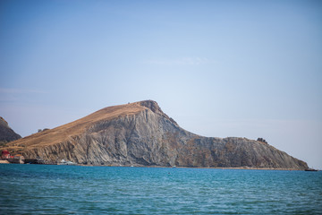 Fototapeta na wymiar Rock by the sea. Sea background