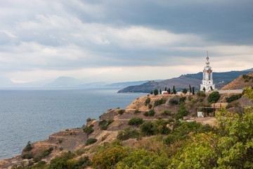 Fototapeta na wymiar Church on a cliff by the sea