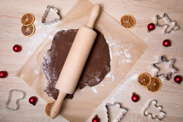 Rolling dough, baking gingerbread men, making christmas gingerbread cookies, cookie cutting, homemade traditional christmas dessert.
