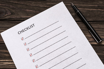 checklist, pen on wooden background. list, business planning.