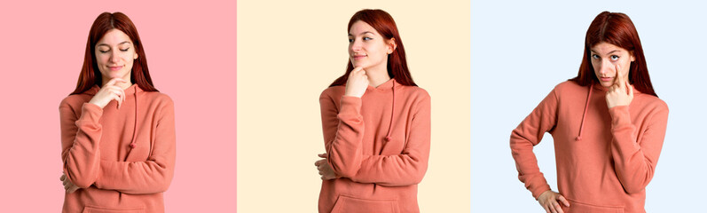 Set of Young redhead girl with pink sweatshirt standing and looking to the side, front and down on colorful background