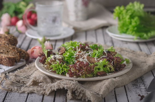 Homemade bio salad lettuce with mushrooms and wholegrain bread