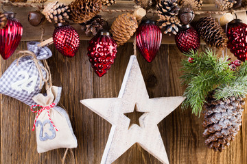 Christmas greeting card. Festive decoration on wooden background. New Year concept. Copy space.  Flat lay. Top view.