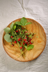 Local forest strawberry on plate