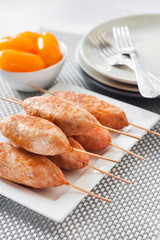 Minced turkey kebabs on square white plate