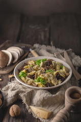 Homemade tortellini with mushrooms and walnuts