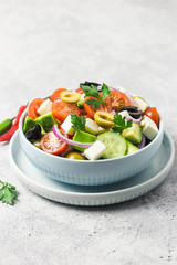 Avocado feta Greek salad in a bowl. Selective focus, space for text.