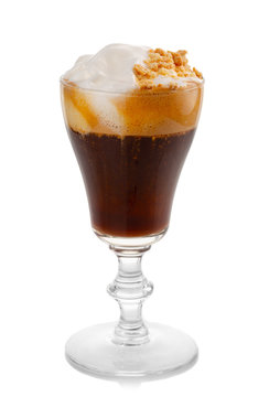 Glass with hot irish coffee isolated on white
