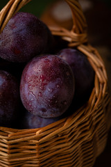Fresh plums close-up in basket