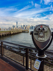 binoculars on bridge with view of manhattan