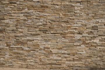 Stone Wall background from modern building contruction facade