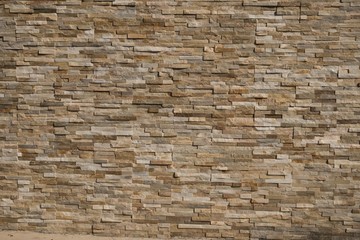 Stone Wall background from modern building contruction facade