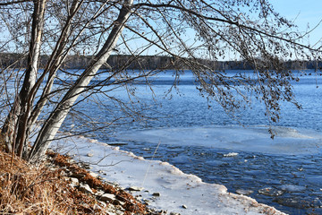 Fototapeta na wymiar Russia, Chelyabinsk region, nature monument - lake Uvildy. Small section of ice near the shore in sunny november day