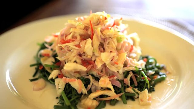 Preparation of healthy low calorie salsa by chef in Balinese cooking class for local people and tourists