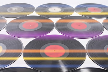 Vinyl records as background in disco light