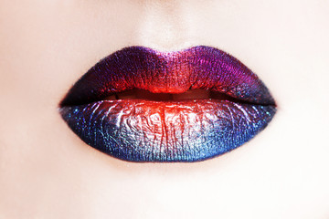 Delightful lip makeup, multi-colored transitions. Beautiful women's lips with bright lipstick,...