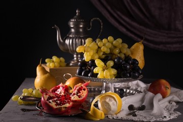 Still life with vintage items, fresh ripe fruit