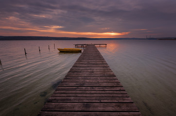 Fototapeta na wymiar Seascape during sunset. Beautiful natural seascape, blue hour. Sea sunset at a lake coast near Varna, Bulgaria. Magnificent sunset with clouds in the middle of February.