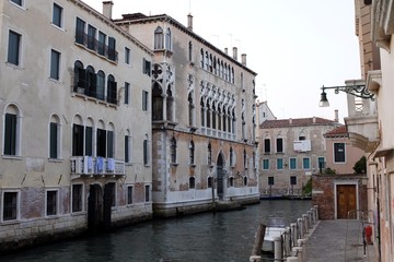 Fototapeta na wymiar Canal street with balcony in Venice, Italy