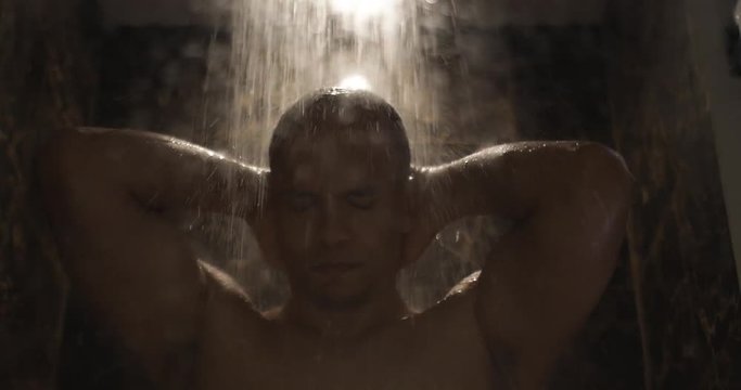Mixed race man gets upset as he takes a shower