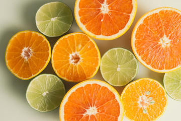 Composition with slices of citrus on color background