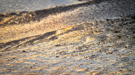 Golden Reflections on Water Background