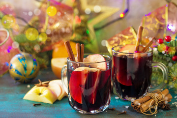 Christmas Mulled Wine or Sangria with Spices. Two glasses of hot mulled wine with Apple and spices...