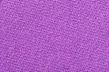 Pink fabric background texture. Detail of textile material close-up