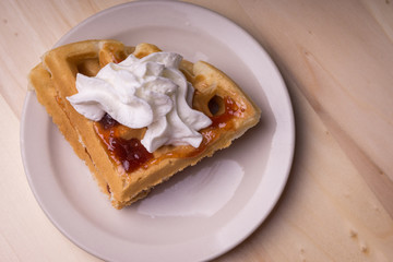 Waffles with jelly and whipped cream