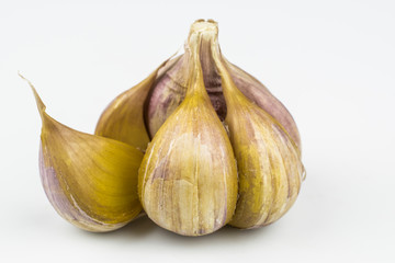 Fototapeta premium A garlic with slices isolated on a white background.