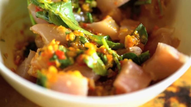 Preparation of skinless raw Mahi Mahi fish local to Bali in bowl with Basa gede