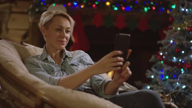 Woman takes selfie in Xmas night