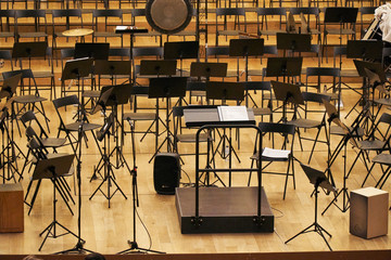 concert hall stage with stands and chairs