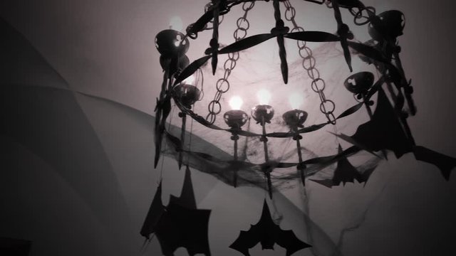 Scary old chandelier in the cobwebs and bats.