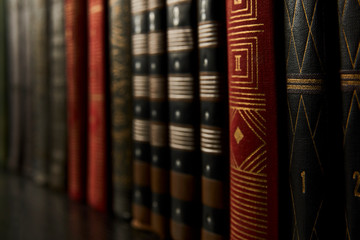 Old books on a bookshelf as abstract background. Vintage books