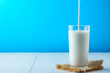 Full glass of milk on a napkin