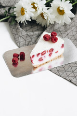 Two pieces of delicious cake with raspberries, sweet dessert