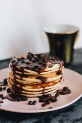 Stack of delicious homemade pancakes with sauce