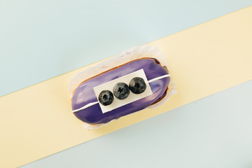 Delicious eclair with glaze, sweet dessert